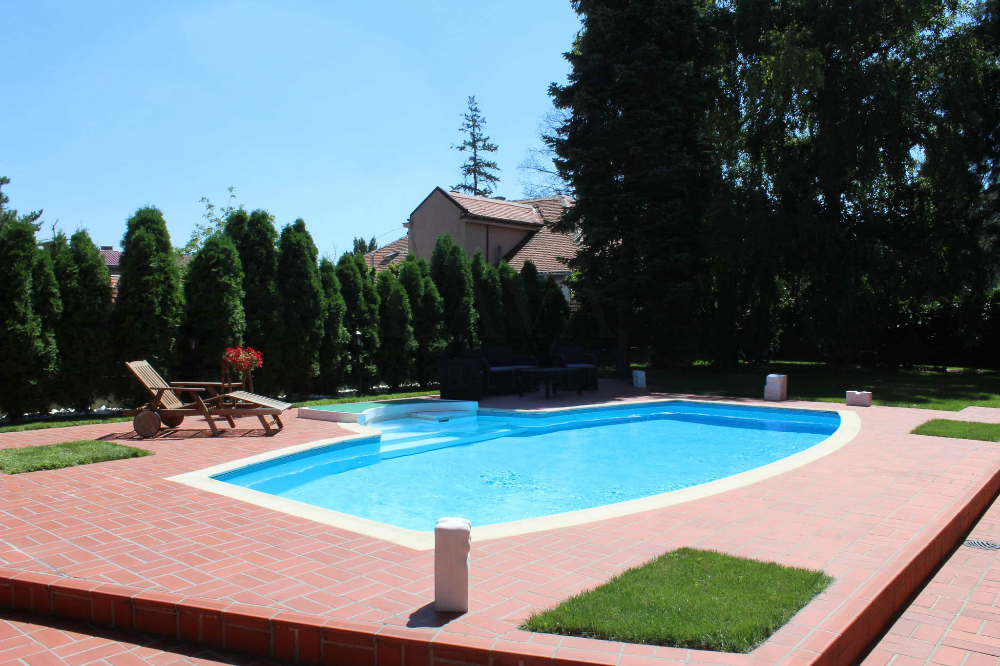 Designer Home with Pool and Stunning Green Surroundings